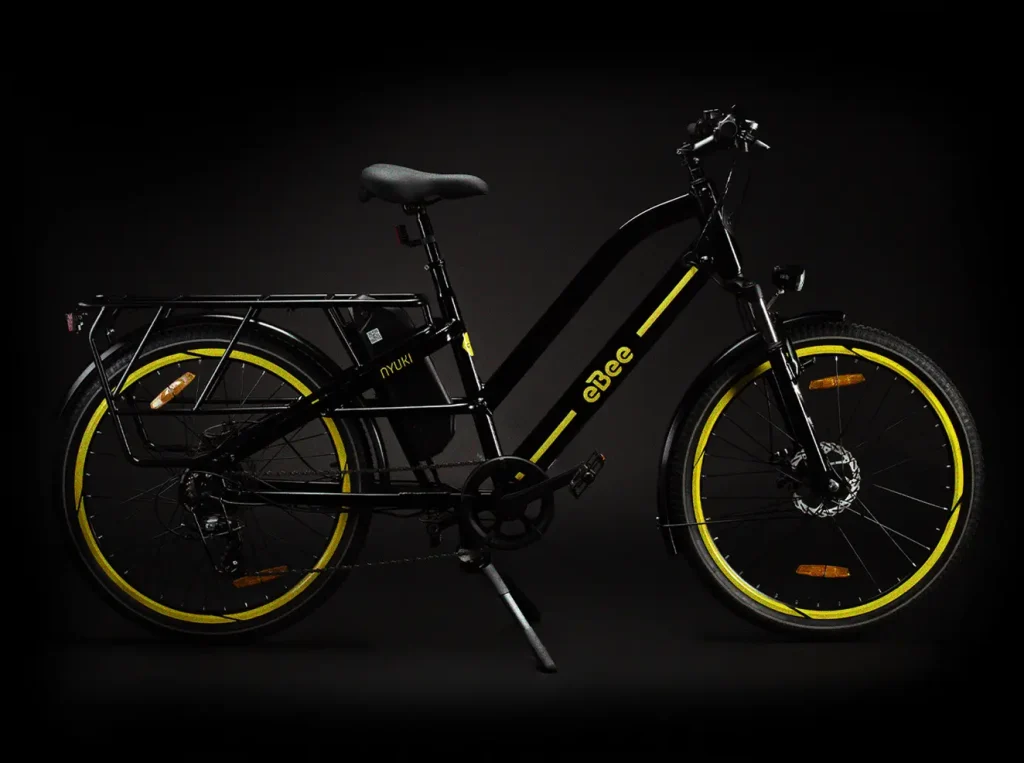 Side profile of the eBee Nyuki electric bicycle: Revealing the sleek frame, sturdy wheels, and comfortable saddle. Large cargo capacity makes it ideal for last mile deliveries and for the every day commuter.